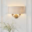 Landover 2lt Wall finished in Vintage Brass and Natural