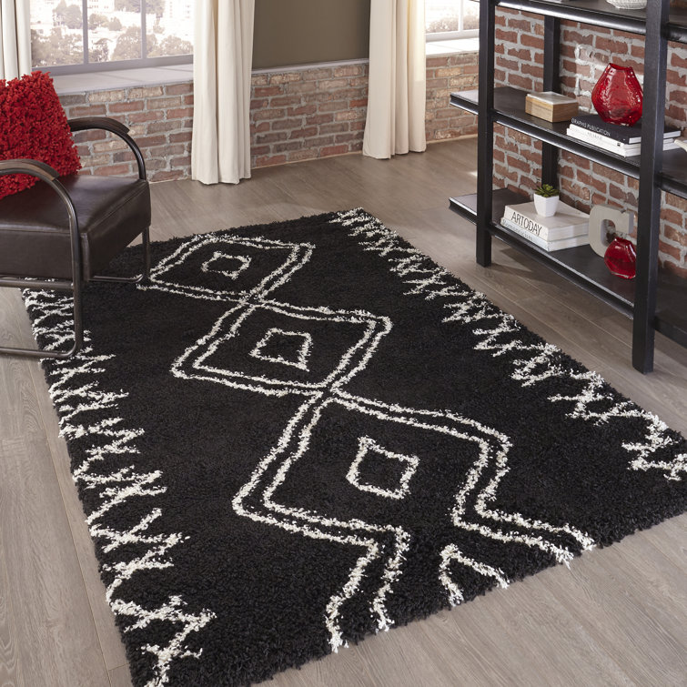 Tapis noir à motif géométrique Coss