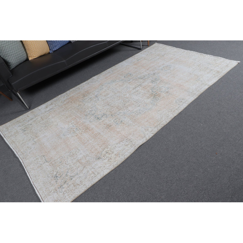 Tapis turc rétro de couleur pastel clair avec un motif délavé pour un décor de salon élégant et unique