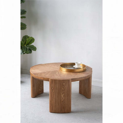 Table basse ronde avec pieds incurvés