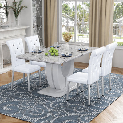 Ensemble de table de salle à manger moderne en faux marbre de 63 po avec chaises en similicuir à ressorts
