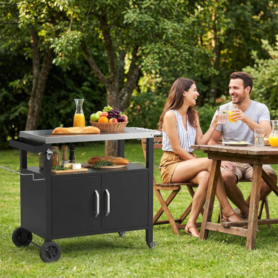  Chariot de barbecue extérieur avec armoire de rangement, îlot de cuisine extérieur avec plateau en acier inoxydable, 2 roulettes verrouillables et 4 crochets pour la préparation des repas au barbecue et les repas à l'extérieur