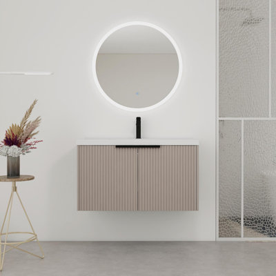 Meuble-lavabo mural avec lavabo en résine et portes à fermeture en douceur, offrant beaucoup de rangement et une conception unique pour améliorer la salle de bain