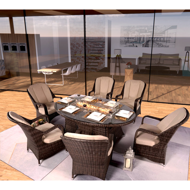 Algird 6 - Person Wicker Patio Dining Set with Oval Table , Cushions Included