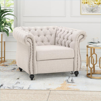 Structure en bois massif recouverte de velours beige chaleureux pour fauteuil de salon