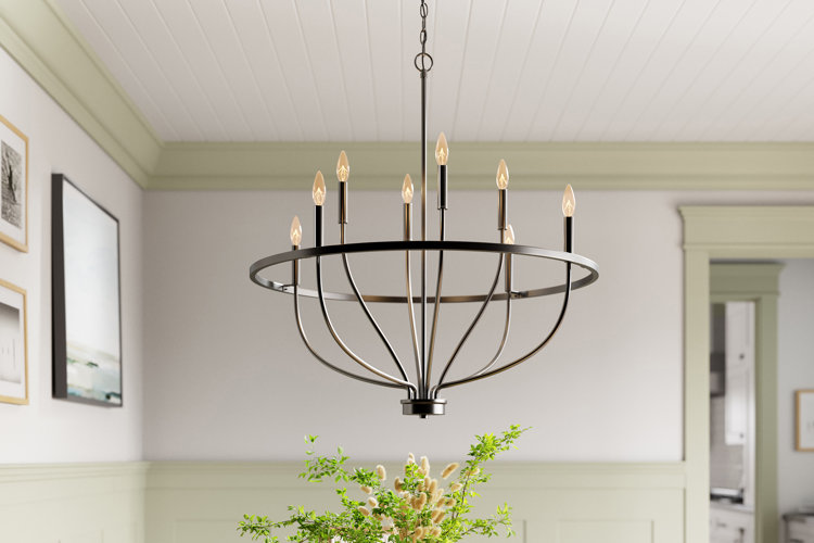 oil-rubbed bronze candle-style chandelier above a dining table