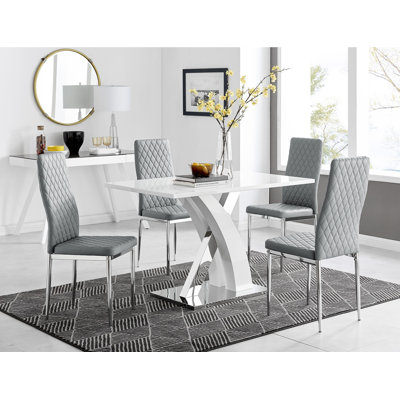 Edzard Chrome & White High Gloss Dining Table Set with 4 Luxury Faux Leather Dining Chairs