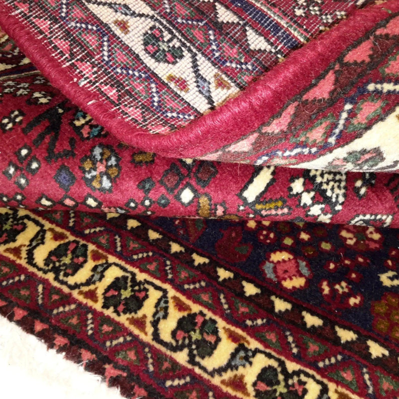 Orfelinda Oriental Area Rug in Red