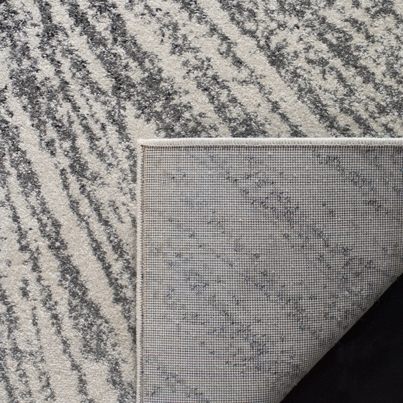 Tapis noir et ivoire à motif abstrait, Rectangle 5 pi 3 po x 7 pi 6 po