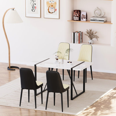 Table de salle à manger moderne de 55 pouces à la mode avec structure en métal et chaises rembourrées épaisses et rembourrées