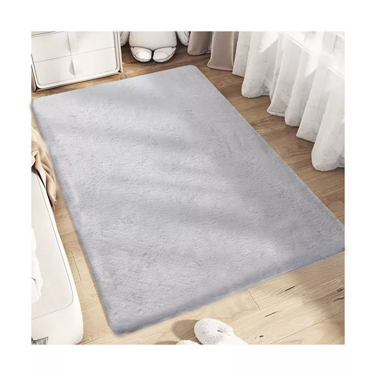 Davyn Solid Handmade Faux Fur Area Rug in Gray