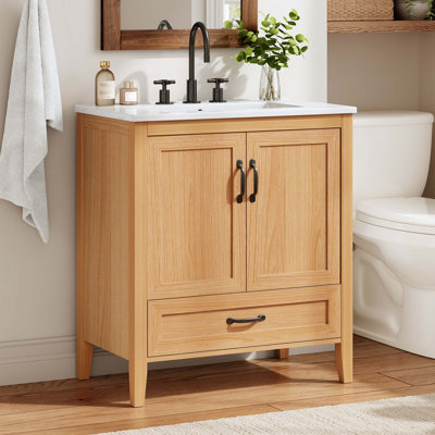 Meuble-lavabo en bois naturel de 30 po avec lavabo en céramique, portes et tiroir à fermeture en douceur, tablette réglable et plomberie à dossier ouvert.