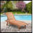 Outdoor Chaise Lounge Pool Chair With Built-In Side Table, Reclining Backrest For Sun Tanning & Sunbathing, Smooth Rolling Wheels, Red Wood Look Finish