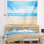 Tapisserie bleu ciel large de mer-28501281