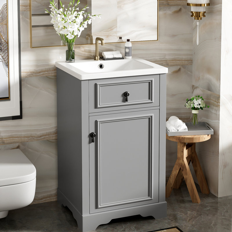 Meuble-lavabo de 20 pouces avec lavabo en céramique, porte à fermeture en douceur et tablette réglable pour un accès facile à la plomberie dans les salles de bain