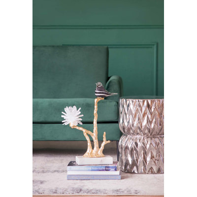 Figurine oiseau sur une branche