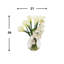 Orchids, Calla Lily And Philodendron Leaves Arranged In A Clear Circular Glass Vase