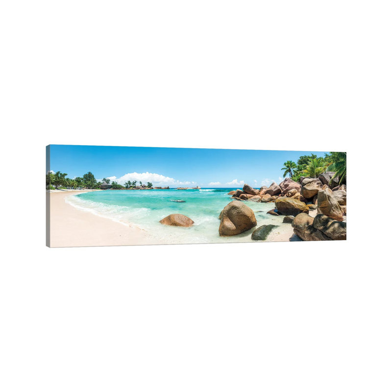 Panoramic View Of A Tropical Beach On The Island Of Praslin, Seychelles by Jan Becke - Wrapped Canvas Panoramic Print