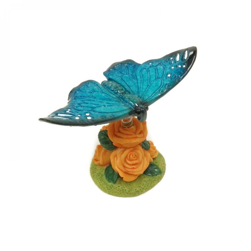 Figurine papillon bleu sur une fleur, Bleu / Vert / Orange