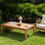 Table basse d'extérieur en bois massif avec plateau à lattes Weslyn