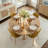 Cleckley 4 - Person Dining Table Sets With 39.4'' Round Table & 4 Upholstered Fabric Chairs-98980723