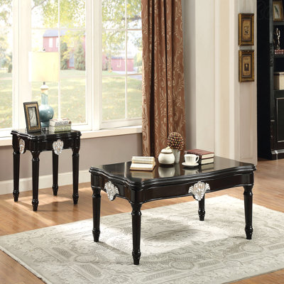 Table basse noire avec pieds tournés