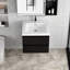 Meuble-lavabo de 24 po avec comptoir en résine - en noir brillant. Tiroirs à fermeture en douceur pour l'organisation flottante et armoire noire. Un élégant