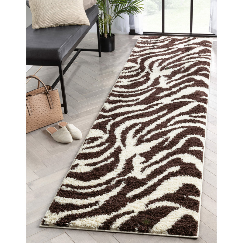 Tapis noir / blanc cassé à motif animalier Dondre