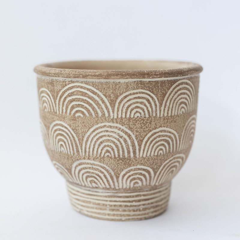 Boîte à fleurs beige avec motif d'arche blanche