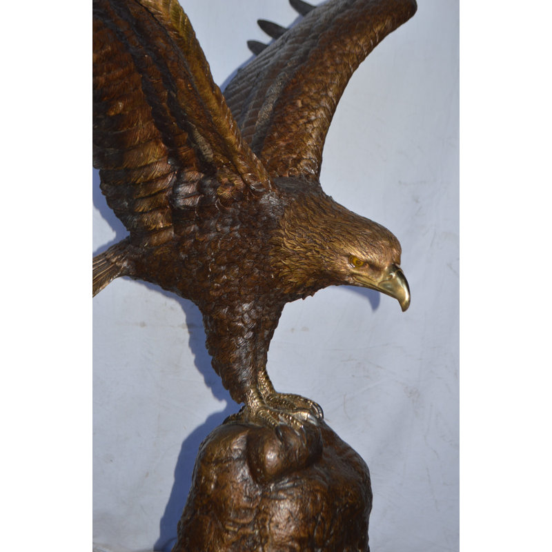 Eagle Landing On A Rock Bronze Statue - Size: 51"L X 36"W X 58"H.