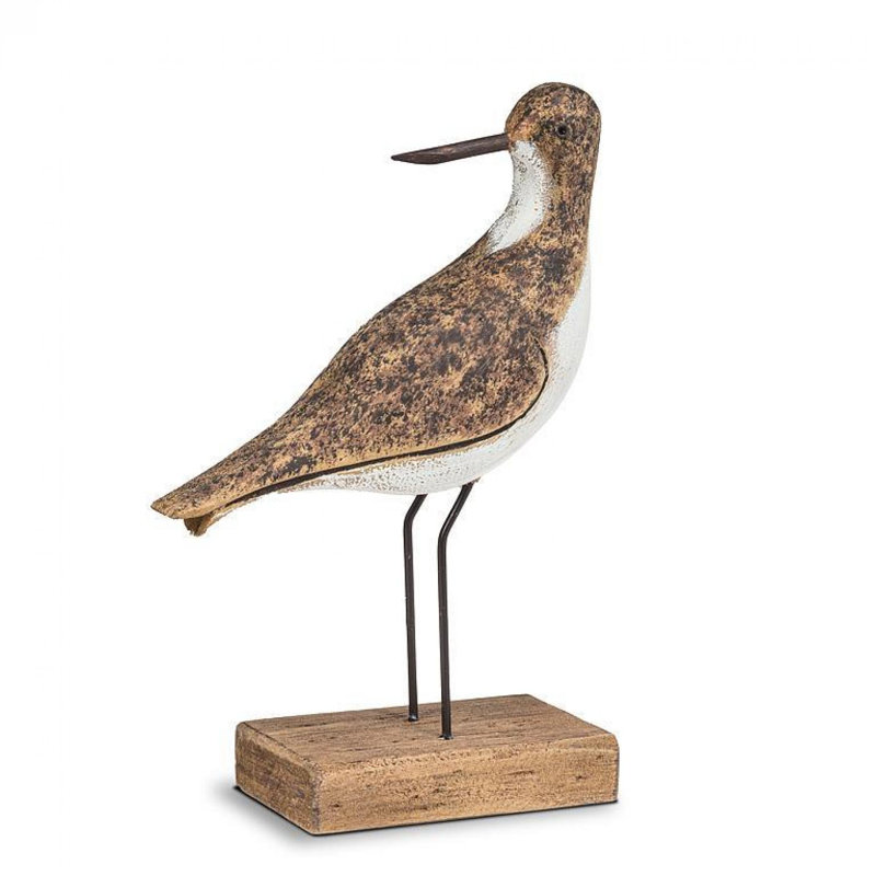 Figurine oiseau regardant en arrière sur une base