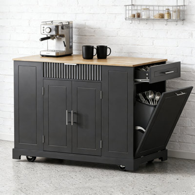 Fluted Kitchen Island with Trash Can Storage, Power Outlet, and Rolling Wheels for Modern Kitchens.
