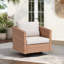 Chaise d'extérieur pivotante en rotin avec coussins
