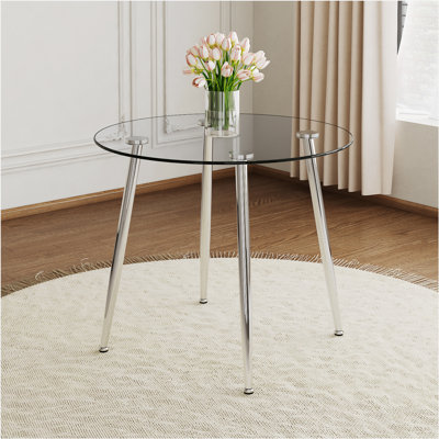 Chawki Round Dining Table With Glass Top, Metal Legs, Exquisite Life, Starting From The Details, The Legs Show An Extraordinary Texture, Which Is The by Wade Logan