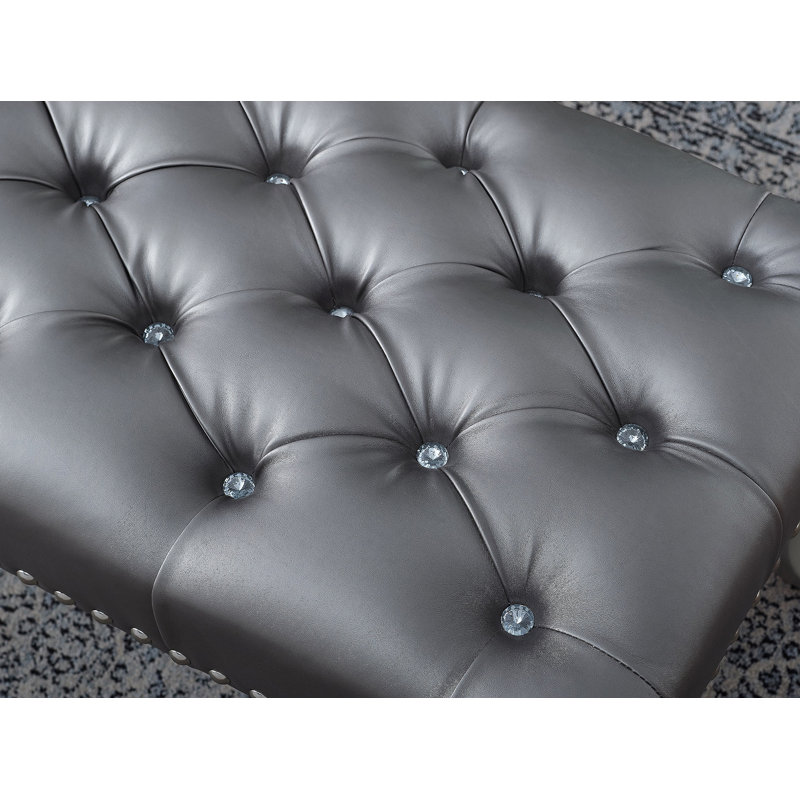 Banc capitonné en tissu avec garniture cloutée