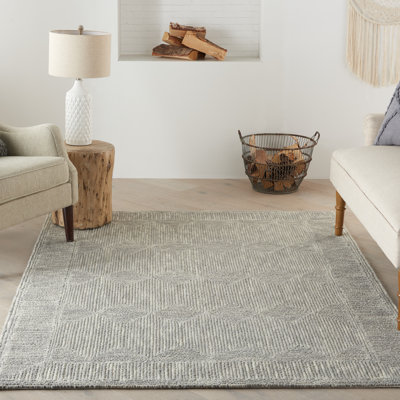 Tapis gris en laine touffeté à la main