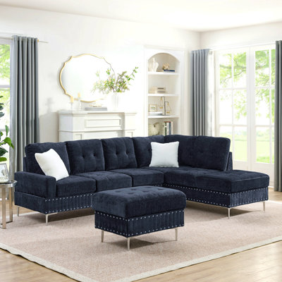 Canapé modulaire 3 places avec méridienne, repose-pieds avec rangement, pieds en métal et clous en cuivre, deux coussins blancs, bleu marine