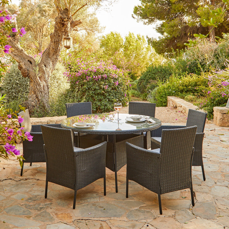 Dubose 6 - Person Wicker Patio Dining Set with Round Table , Cushions Included, Black, No