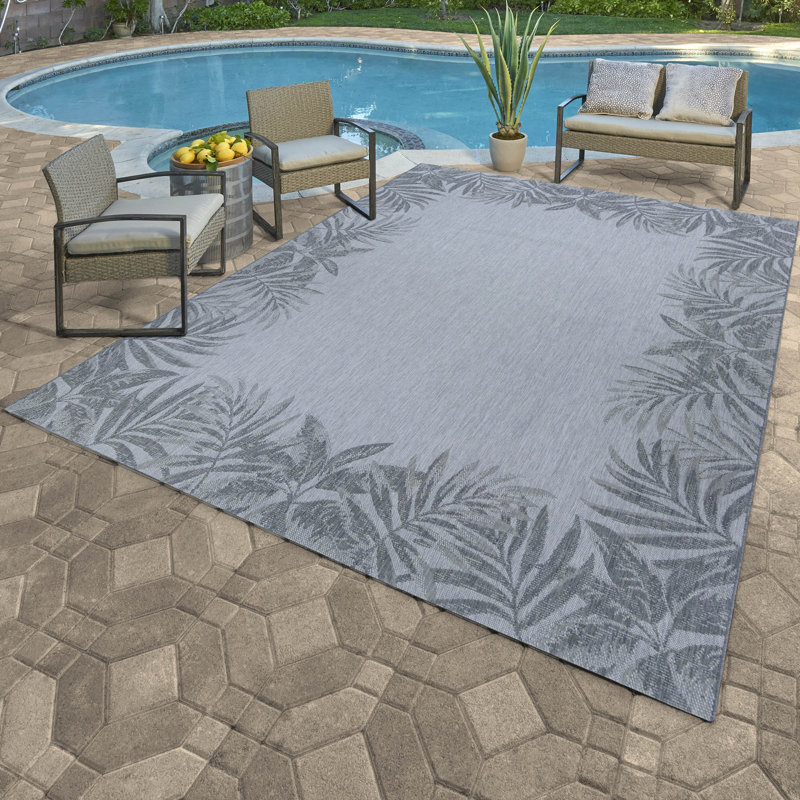 Tapis intérieur / extérieur en polypropylène tissé à plat à motif de feuilles ivoire Solterra Isola