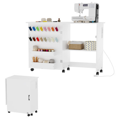 Foldable Sewing & Craft Table with Charging Station, Space-Saving Desk with Lockable Wheels, Storage Trays & Pegs, Portable Cabinet for Small Spaces, White