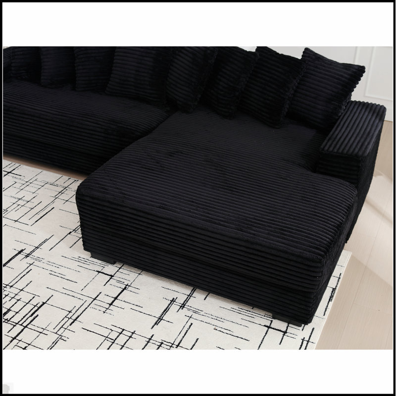 Canapé confortable surdimensionné en velours côtelé avec plusieurs coussins pour la détente et le style moderne