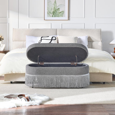 Repose-pieds ovale rembourré avec rangement à franges et couvercle relevable - L 39 po x l 16 po x H 17 po, repose-pieds multifonctionnel et rangement caché pour le salon ou la chambre à coucher - Tissu gris avec structure en métal