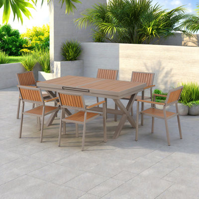 Freedom Outdoor Dining Table Set Including Six Chairs And A Extendable Table