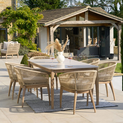 Geraldo 6 - Person Acacia Rectangular Solid Wood Patio Dining Set with Cushions included