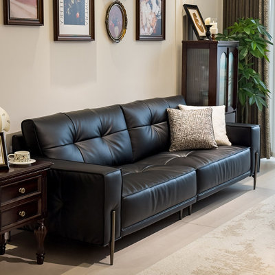Causeuse-coussin modulable noire en cuir véritable