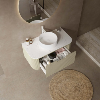 Meuble-lavabo flottant avec lavabo en céramique, plateau en pierre frittée, armoire en contreplaqué, tiroir à fermeture en douceur et finition rayée 3D vert clair.