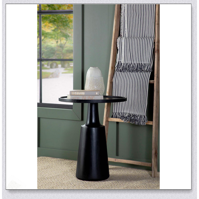 Élégante table d'appoint piédestal en teinture noire avec base profilée solide et fabrication écologique en bois de manguier