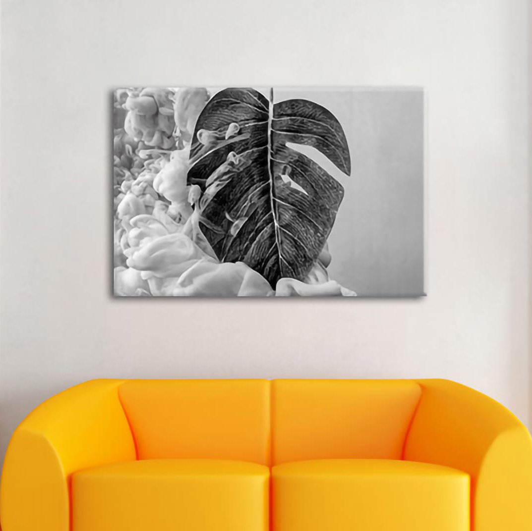 Leinwandbild Monstera-Blatt mit pastellfarbener Wolke