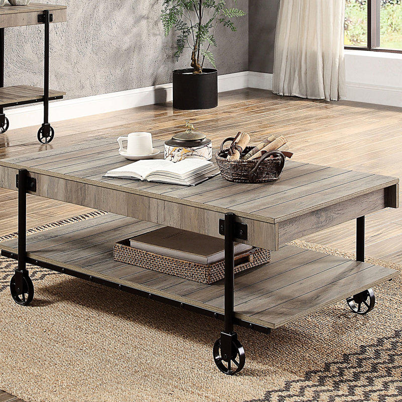 Table basse industrielle 1 pièce avec tablette inférieure ouverte, caractéristique esthétique du bois reproduit, arrangement de soutien des pieds en forme de roue, éléments de conception à lattes, aspect naturel et noir, largeur de 26,15 po