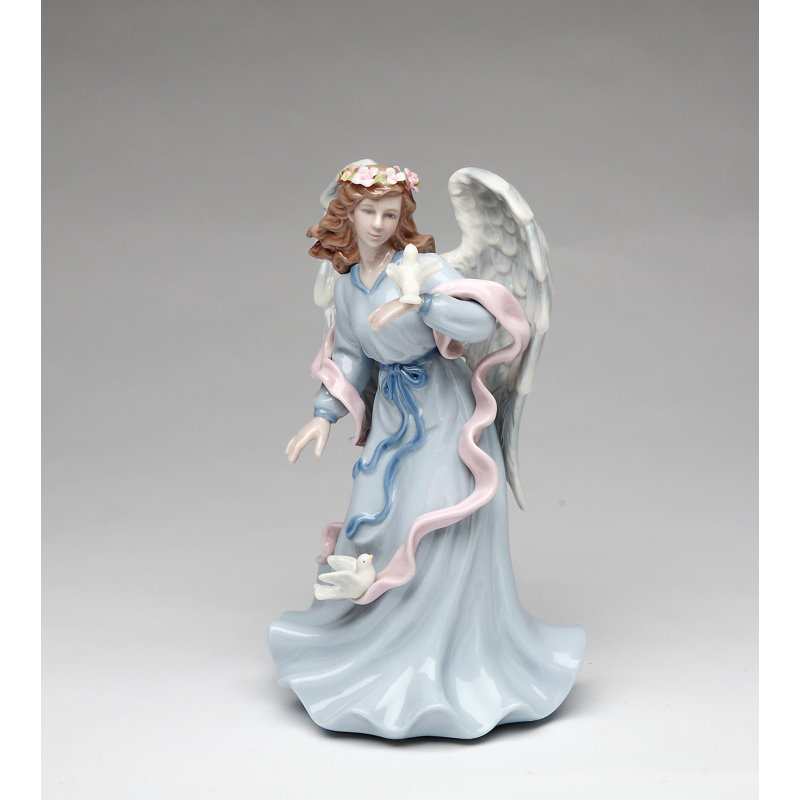 Figurine musicale ange tenant une colombe